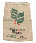 Jute bag with 'Cafés do Brasil' branding and leaf design on a white background