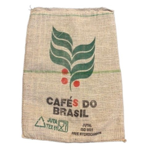 Jute bag with 'Cafés do Brasil' branding and leaf design on a white background