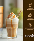 Caramel frappuccino with whipped cream and a Monén branded container on a blurred background