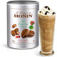 Le Frappe de Monin coffee frappe base canister with a glass of frappe on a white background