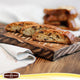 Biscotti on a wooden board with Pan Dècale logo at the bottom.