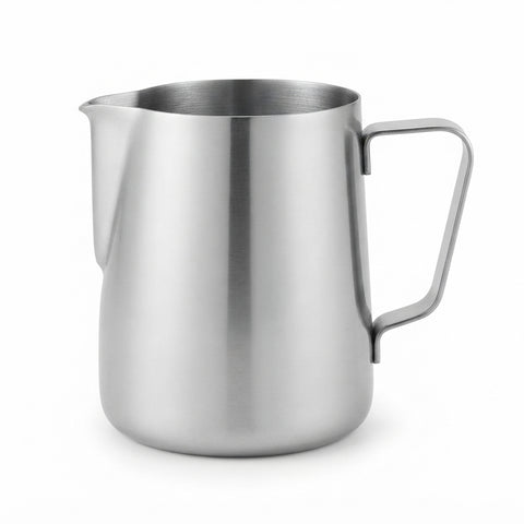 A stainless steel milk pitcher with a flat handle and pouring spout, shown on a clean white background.