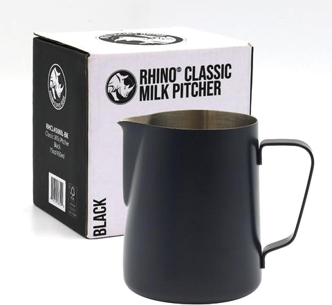 A black metal milk pitcher with a handle and pouring spout, shown in front of its white and black Rhino Classic Milk Pitcher box on a light gray background.