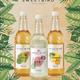 Three bottles of Sweetbird tropical fruit syrups on a leafy background
