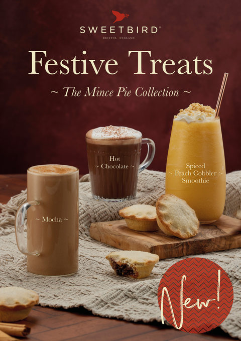 Promotional image of Sweetbird Festive Treats with drinks and mince pies on a wooden table.